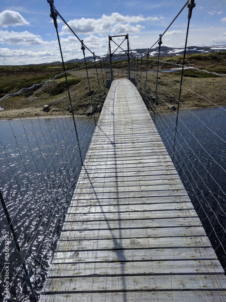 Fototapeta premium Crossing the river in Haradngervidda Norwau