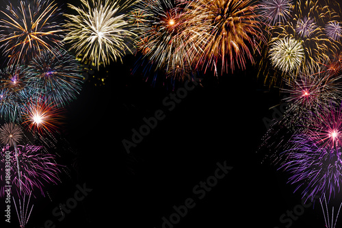 isolated colourful fireworks background with space in the middle