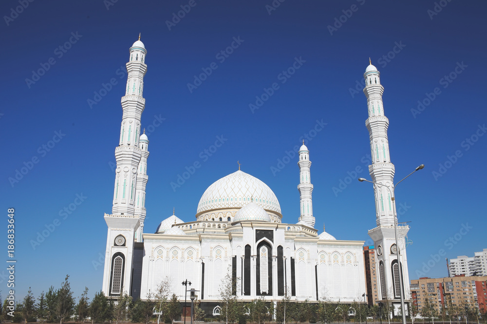 White urban mosque in the summer day