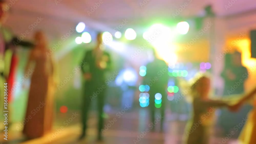 Background of the dance is blurred people dancing in a nightclub. Background of the dance is blurred people dancing in a nightclub.