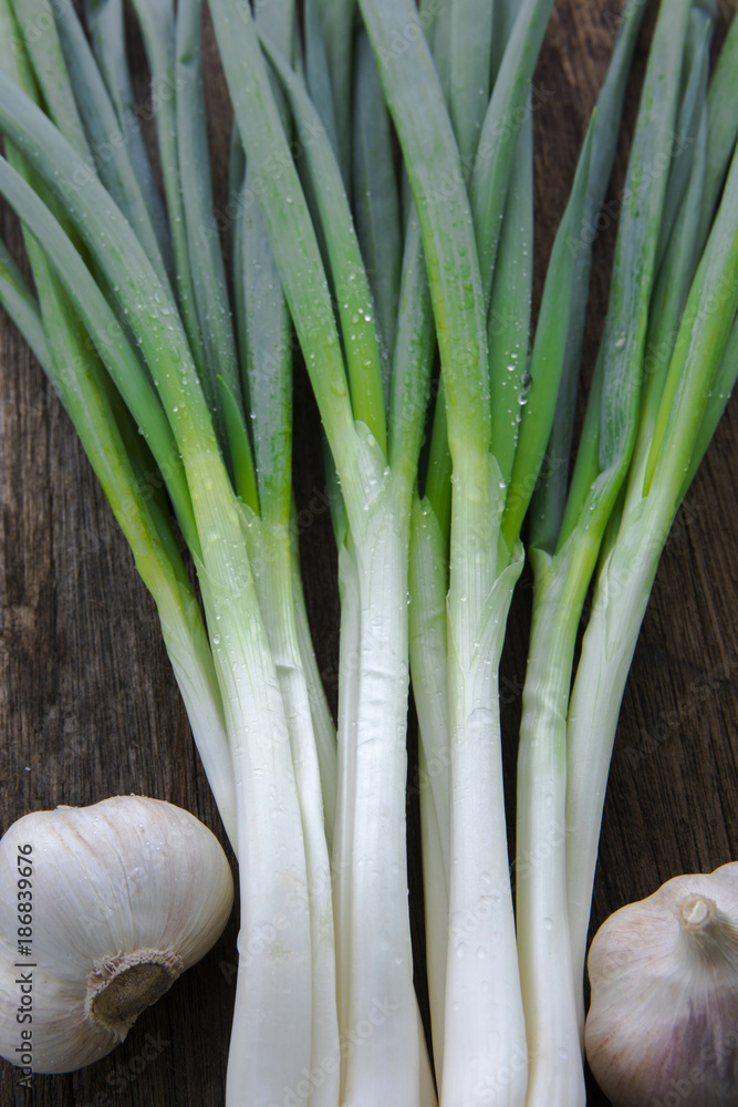 Onion and garlic, cooking food is very important seasoning spices, long onions and garlic, on the table in the wood, Onion and garlic, cooking food is very important seasoning spices, long onions and garlic, on the table in the wood,