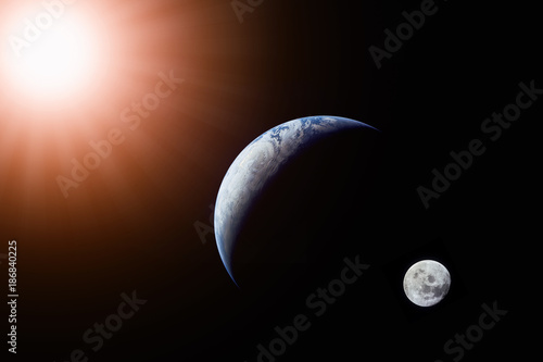 Landscape image of Sun, Earth and moon view from space. (Elements of this image furnished by NASA)