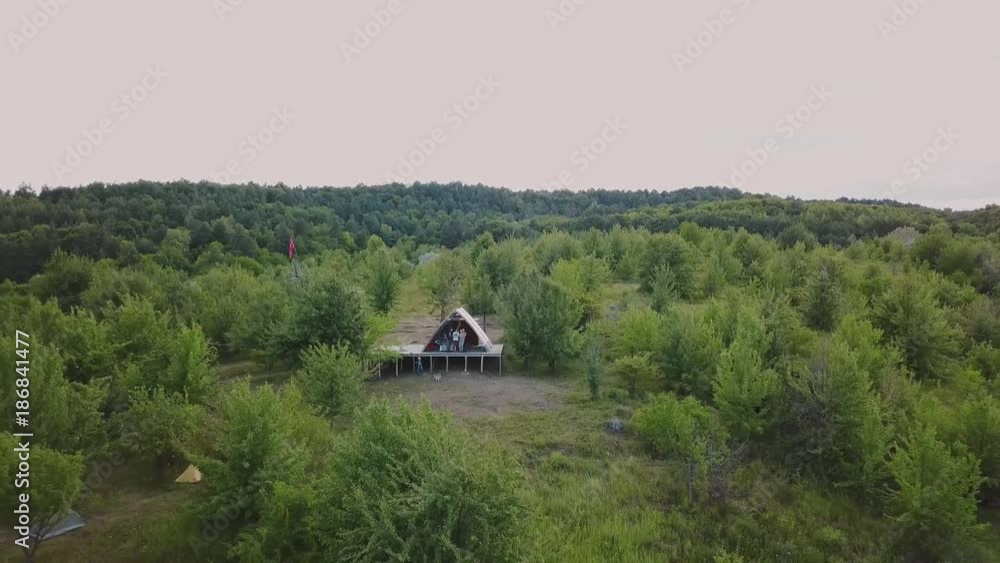 Group of people taking selfie by the drone.A wonderful flight to the beautiful forest near the wide river. Beautiful landscapes of forest and field, aeril view. Group of people taking selfie by the drone.A wonderful flight to the beautiful forest near the wide river. Beautiful landscapes of forest and field, aeril view.