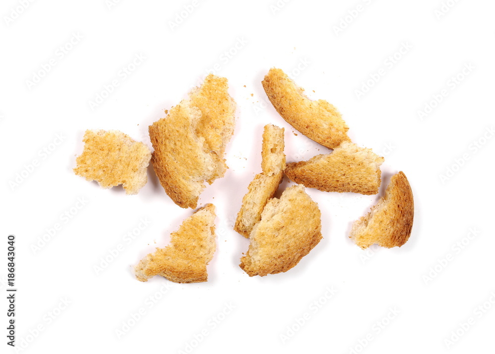 Integral crumbled rusks with wholewheat flour, bread slices isolated on white background, top view Integral crumbled rusks with wholewheat flour, bread slices isolated on white background, top view