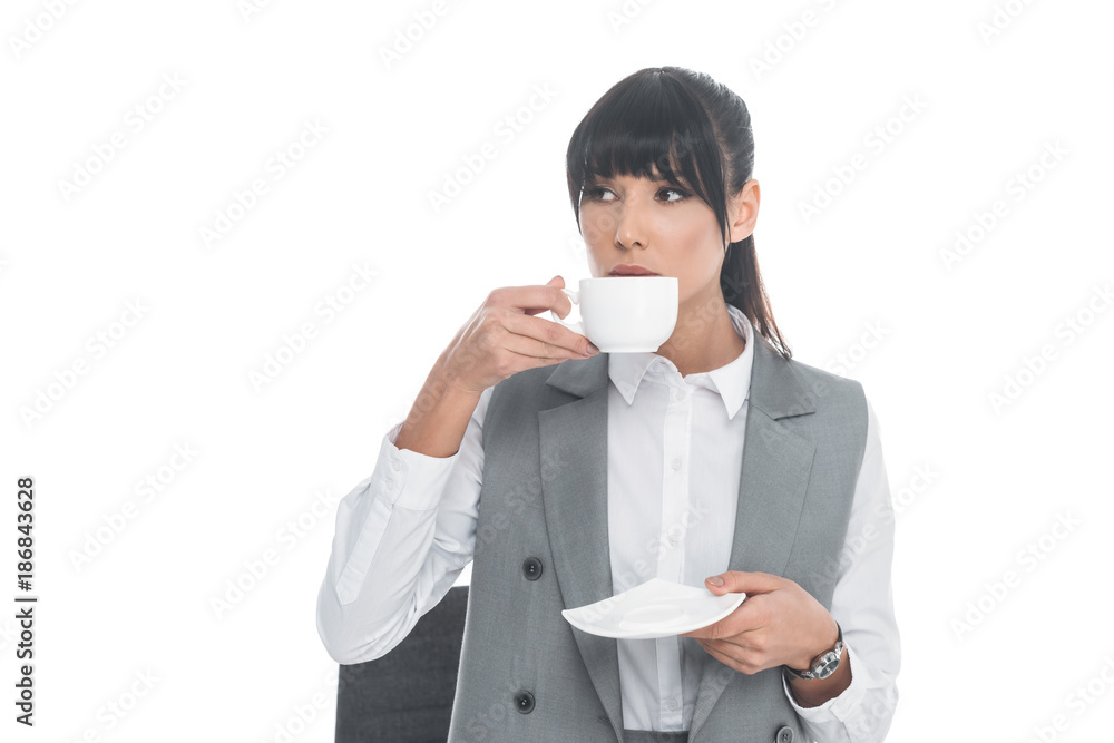 businesswoman drinking tea in office isolated on white businesswoman drinking tea in office isolated on white