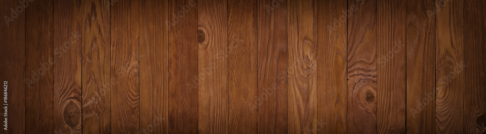 Dark texture wall of brown plank, background wooden surface, panoramic view Dark texture wall of brown plank, background wooden surface, panoramic view
