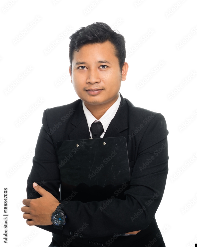 Portrait of a young business man with annual report. Isolated on white background Portrait of a young business man with annual report. Isolated on white background