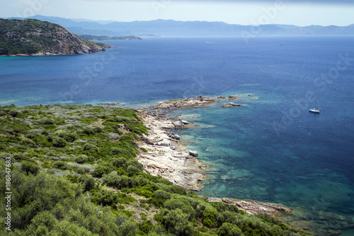 Fototapeta Naklejka Na Ścianę i Meble -  green coastline, azure sea between rocks in the mountains on the island of Corsica