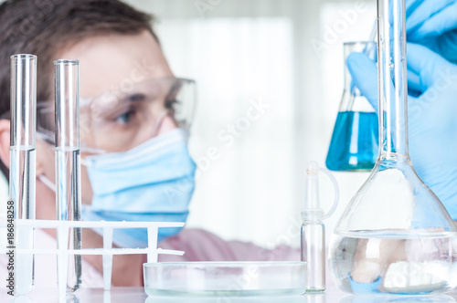 Laboratory scientist working at lab with test tubes