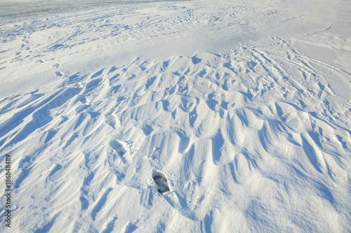 winter snowy surface with footprints 