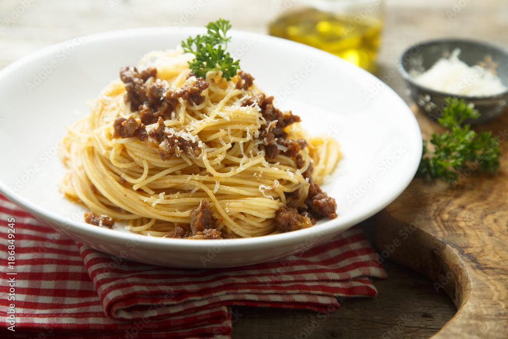 Homemade Bolognese pasta with grated cheese