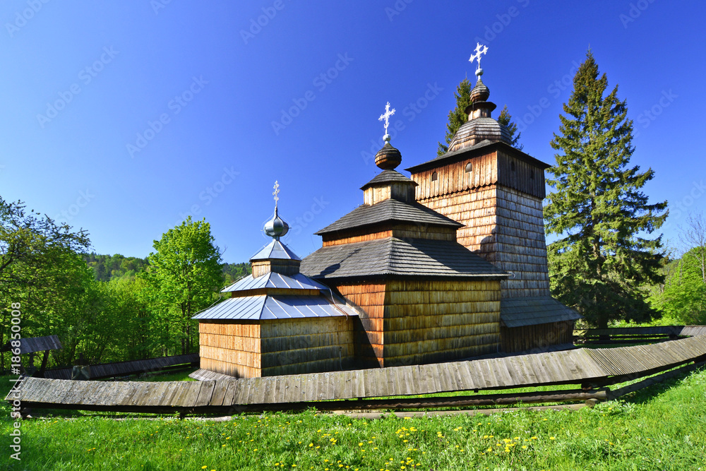 Orthodox  wooden church in Wolowiec in spring sunny day, Low Beskid, Poland
