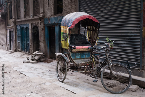 tricycle park beside old building, Kathmandu, Nepal