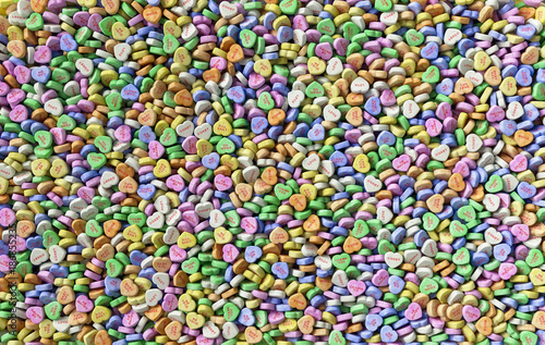 Colorful sweet hearts candies background texture pattern