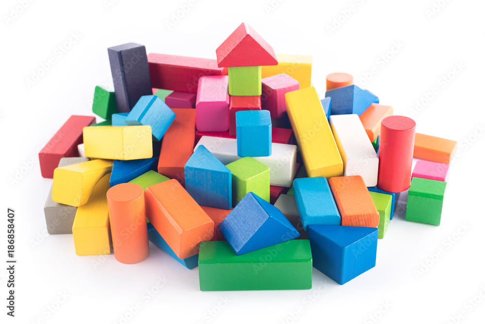 Wooden toys, colorful children's designer on white background, entertainment with a kid, development of preschoolers, construction, game, can move object right or left for create space for text Wooden toys, colorful children's designer on white background, entertainment with a kid, development of preschoolers, construction, game, can move object right or left for create space for text