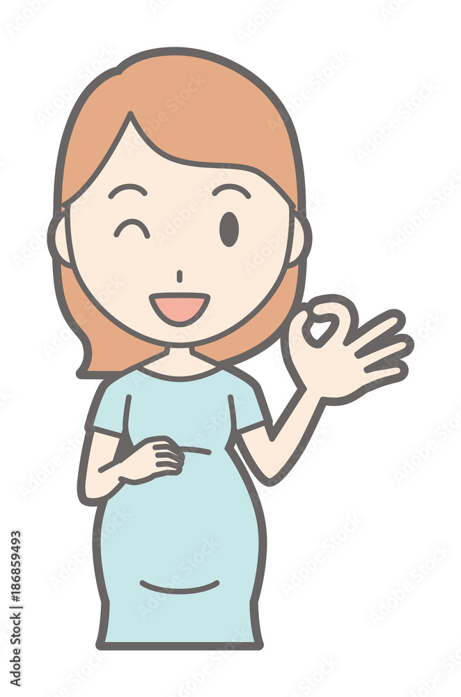 A pregnant woman in green dress is playing an okay sign A pregnant woman in green dress is playing an okay sign