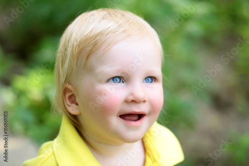 Boy infant smile with blue eyes on adorable face