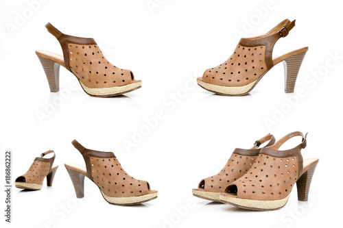 Female brown leather sandal on white background.
