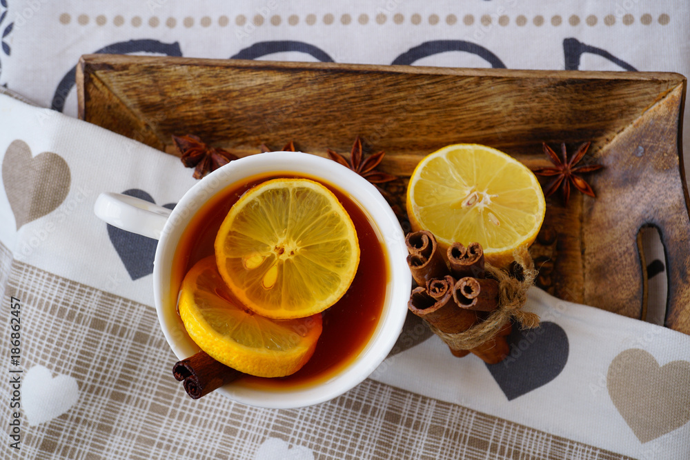 Hot tea in white cup with lemon. Selective focus, top view. Still life, food and drink, seasonal and holiday concept
Hot tea in white cup with lemon. Selective focus, top view. Still life, food and drink, seasonal and holiday concept