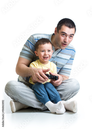 child boy and father play with a playstation together