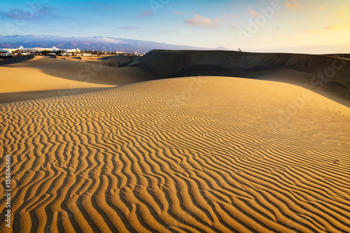 Lonely photographer on dunes in Maspalomas the Gran Canaria island.