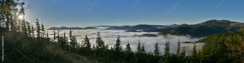 Panoramic of a valley covered with sea of clouds Panoramic of a valley covered with sea of clouds