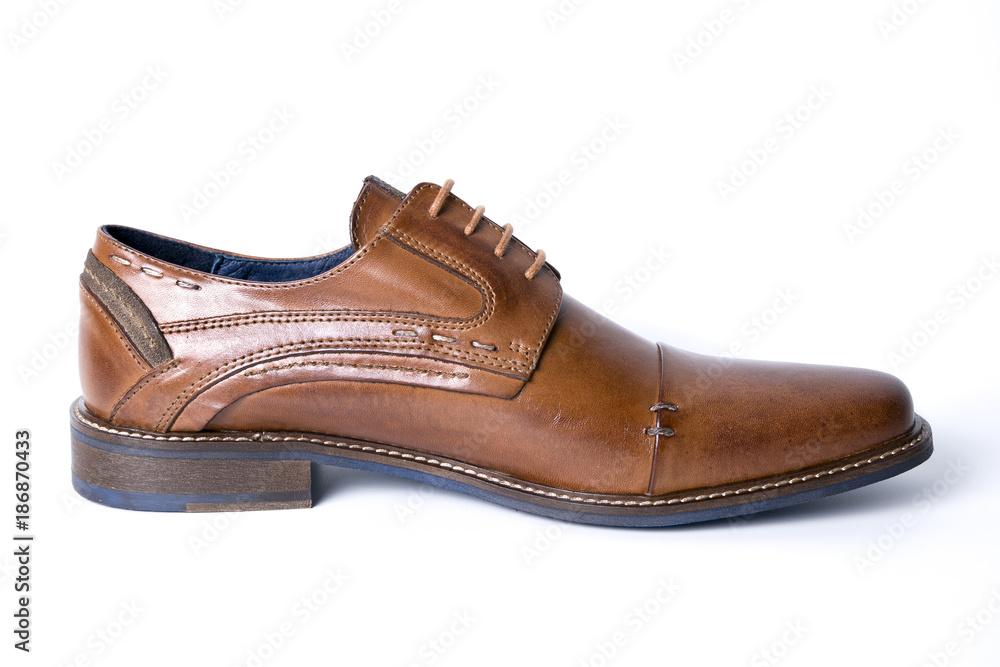 Male brown leather shoe on white background, isolated product, comfortable footwear. Male brown leather shoe on white background, isolated product, comfortable footwear.