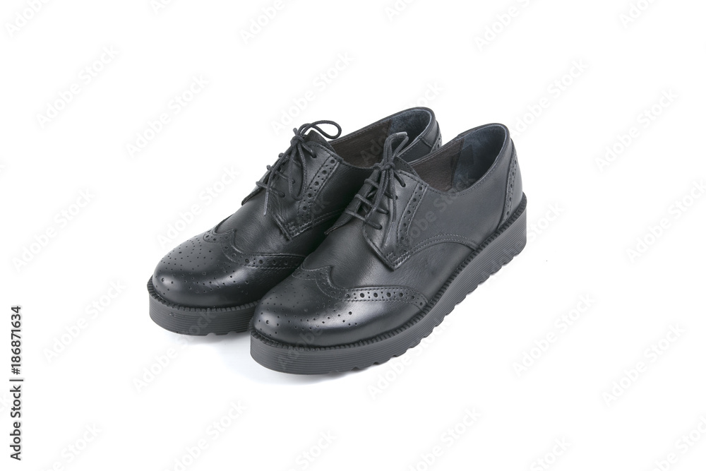 Female black leather shoe on white background, isolated product, comfortable footwear. Female black leather shoe on white background, isolated product, comfortable footwear.