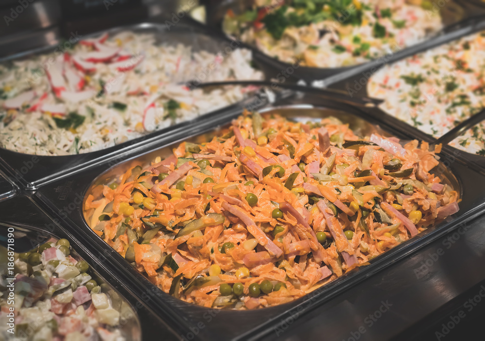 Stand with salads in the diner with self-service. Stand with salads in the diner with self-service.