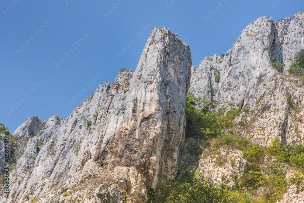 Mountain range with blue sky background in Cheile Turzii, Romania. Mountain range with blue sky background in Cheile Turzii, Romania.