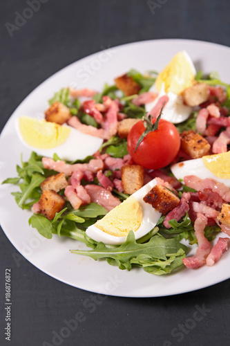 fresh salad with egg,bacon and tomato