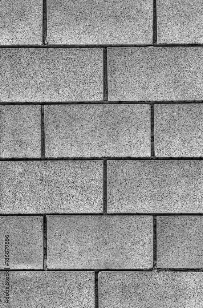 Fototapeta premium Stylish stone wall background in black and white
