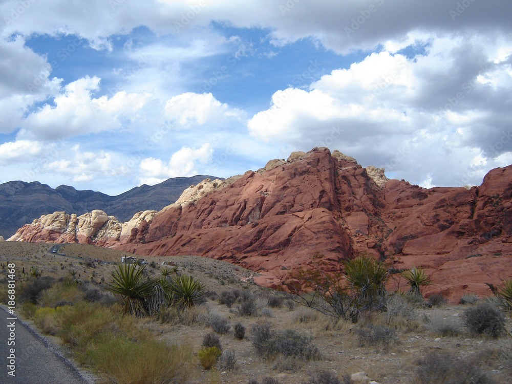 Fototapeta premium Driving through Nevada with Mountains and a Blue Sky Background