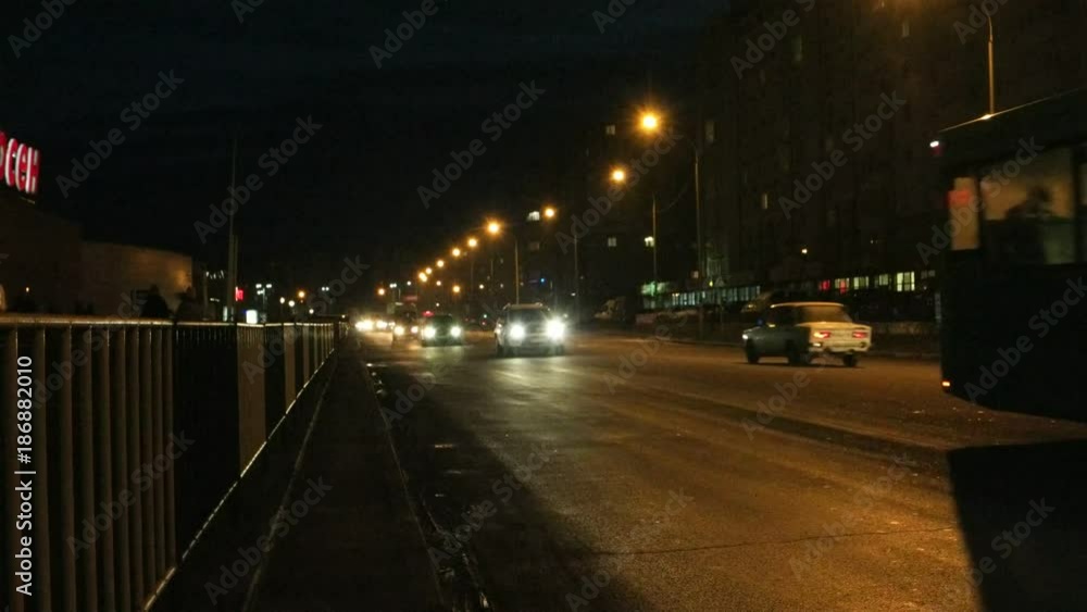 The movement of cars through the streets of the night city The movement of cars through the streets of the night city