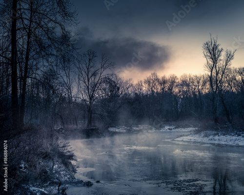 Misty sunrise over cold river