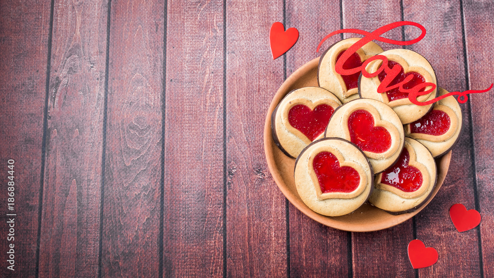 Homemade Cookies with a Red Jam Heart Valentine's Day Dark Wooden Background Copy Space Homemade Cookies with a Red Jam Heart Valentine's Day Dark Wooden Background Copy Space