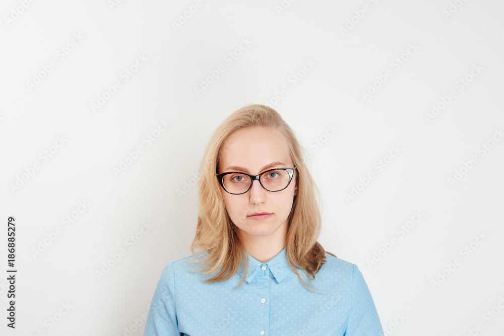Business portrait. Blonde girl talking on the phone on white background