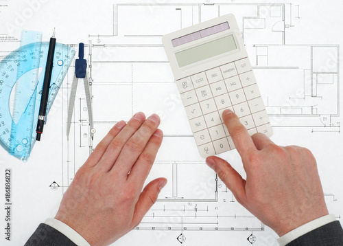 Architect with calculator