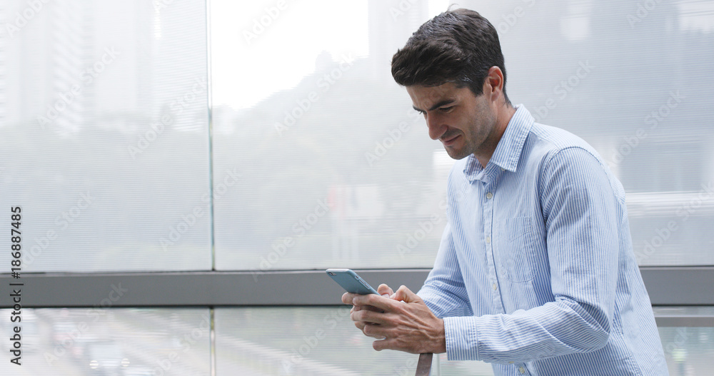 Fototapeta premium Businessman use of cellphone