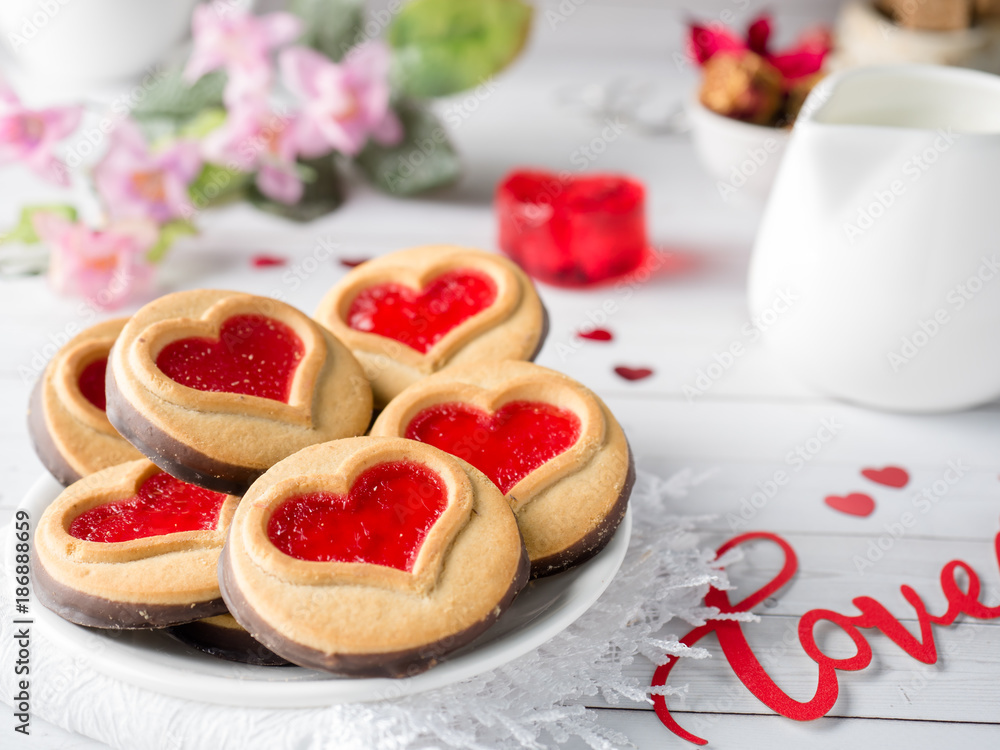 Homemade Cookies with a Red Jam Heart Valentine's Day Cup of tea Homemade Cookies with a Red Jam Heart Valentine's Day Cup of tea