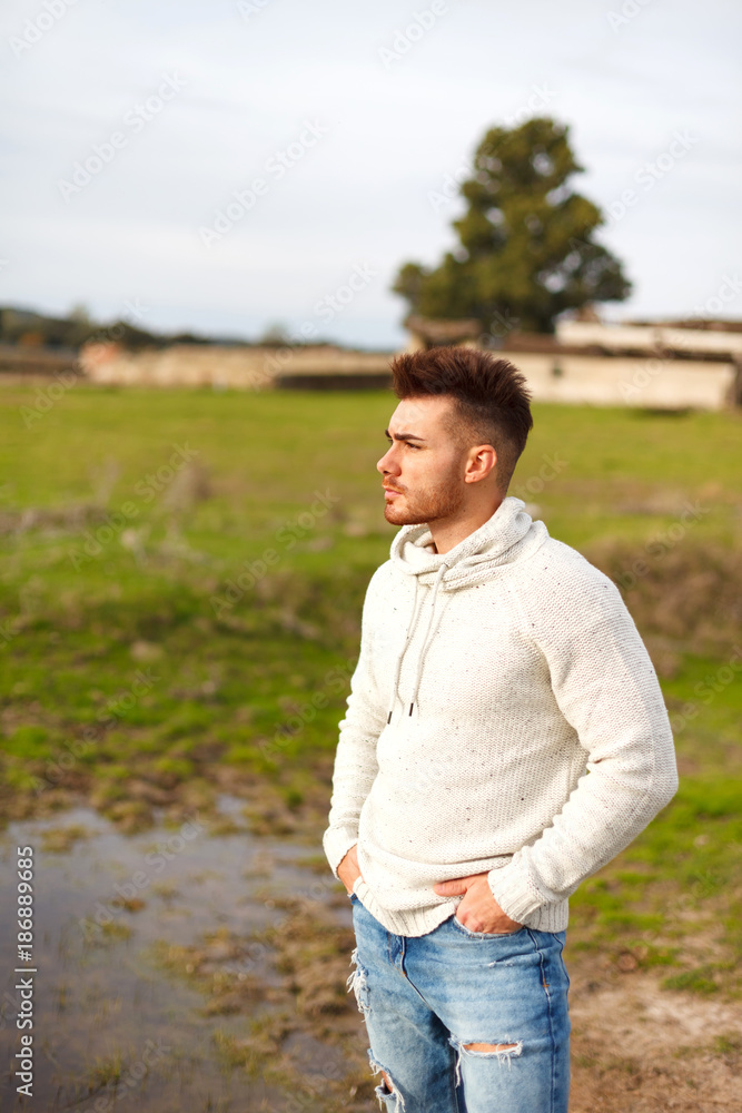 Attractive guy with beard in the meadow Attractive guy with beard in the meadow