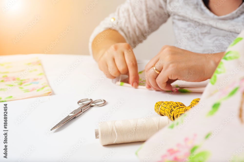 hands of young woman sewing hands of young woman sewing