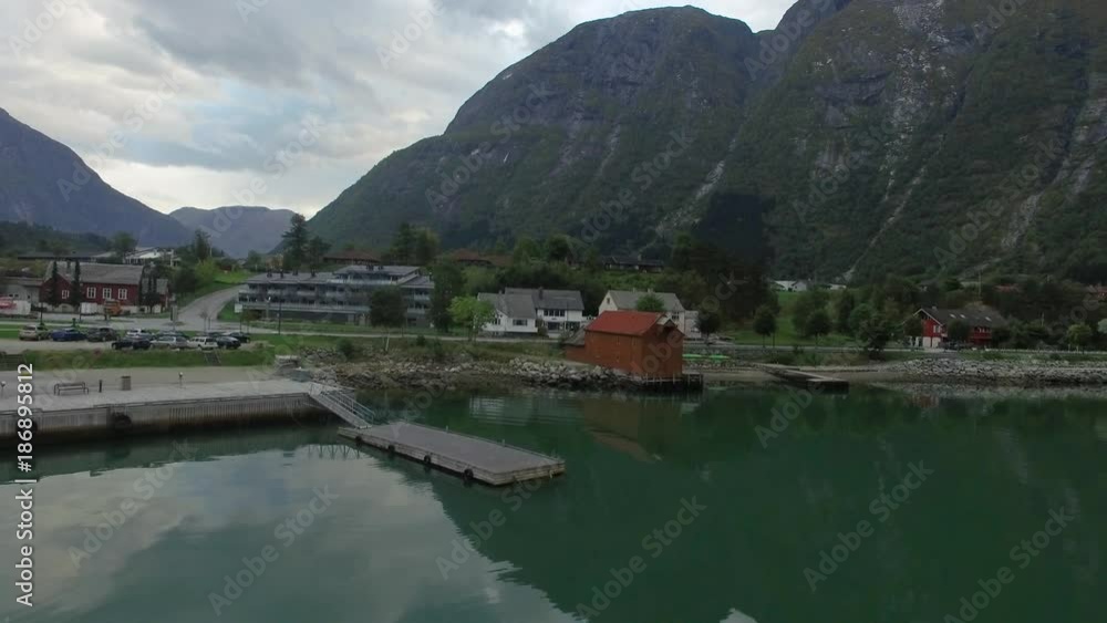 Norwegian town with surrounding mountains and fjord Norwegian town with surrounding mountains and fjord
