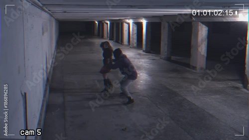 robbing a girl in an underpass. Recording from a surveillance camera