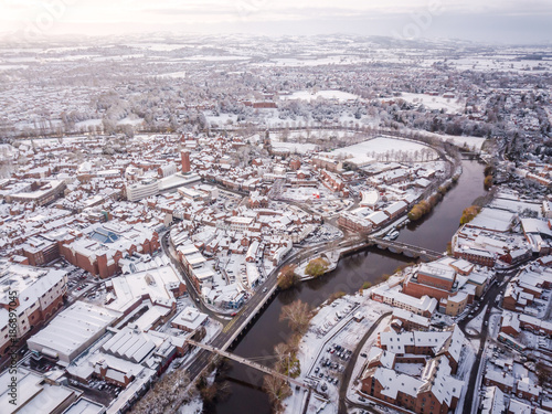 Aerial view of snowy historic English town, Shrewsbury. 1100 year old Market Town in England is covered in snow at Christmas