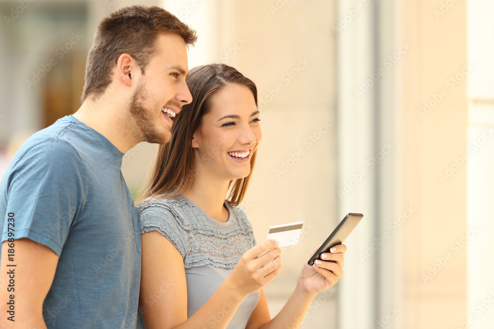 On line buyers shopping on a mall On line buyers shopping on a mall