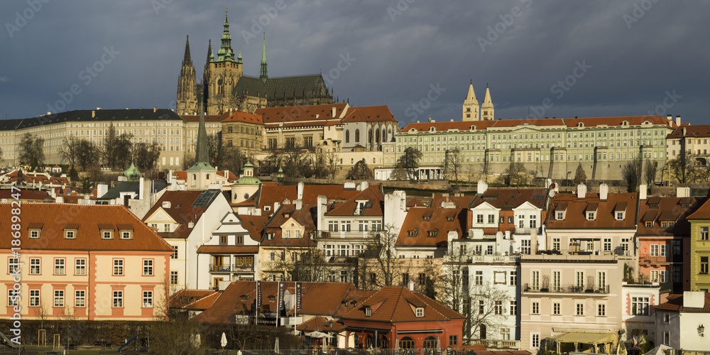 Buildings in city with Prague Castle and St Vitus Cathedral in background, Prague, Czech Republic