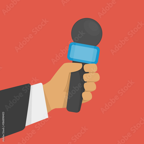 Hand holding microphone.