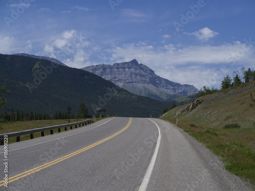 Fototapeta Naklejka Na Ścianę i Meble -  Highway 541 with mountains in the background, Kananaskis Country, Southern Alberta, Alberta, Canada