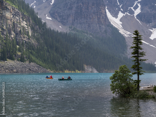 Tourists boating in Moraine Lake, Banff National Park, Alberta, Canada